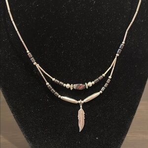 Elegant Silver and Black Feather Pendant Necklace